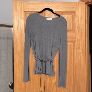 Gray blouse with leather belt